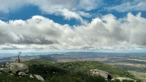 Scenic view of landscape against cloudy sky