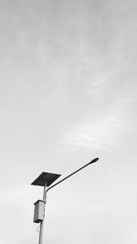 Low angle view of street light against sky