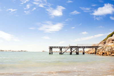 Jetty stretches out into the clear blue water in south australia