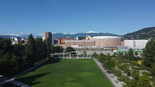 Buildings in city against clear sky