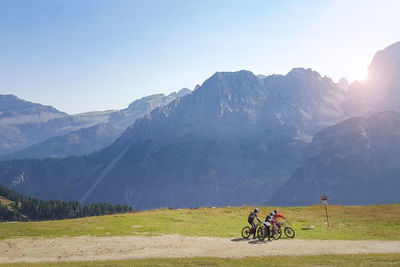 People riding bicycle on mountain road