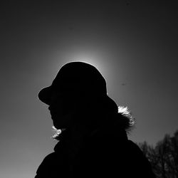 Low angle view of silhouette person against sky