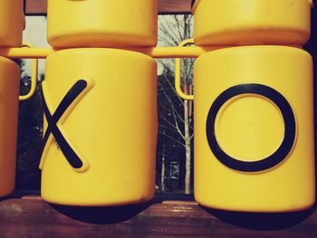 Close-up of yellow objects in row