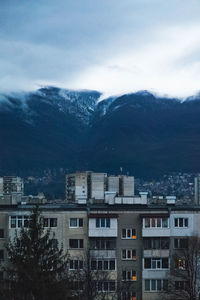 Buildings in city against sky