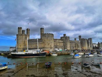 Caernarfon castle viewed across a river. caernarfon. gwynedd. wales.uk