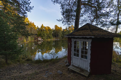 House by lake on a calm autumn day