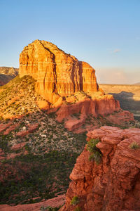 Rock formations on landscape against sky