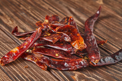 Dried red hot pepper on wooden vintage background