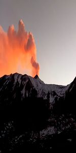 Scenic view of volcanic mountain against sky