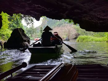 Man moving on boat in water