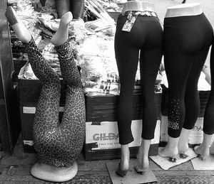 Low section of woman standing on tiled floor