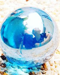 Close-up of blue glass in bowl