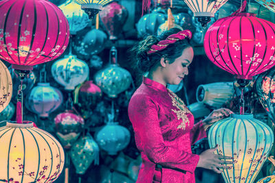 Woman holding colorful balloons