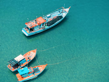 High angle view of fishing boats moored on sea