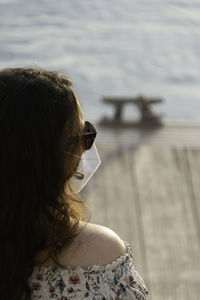 Rear view of woman wearing hat