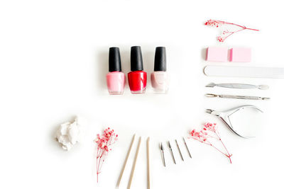 High angle view of pink roses on white table