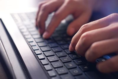 Close-up of hands using mobile phone