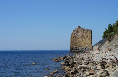 Scenic view of sea against clear blue sky