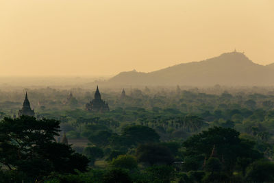 Panoramic view of temple against sky during sunset