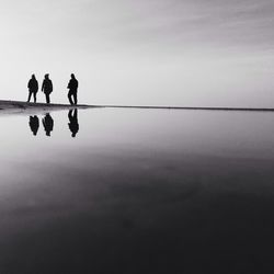 Silhouette people on beach