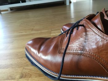 High angle view of shoes on wooden table