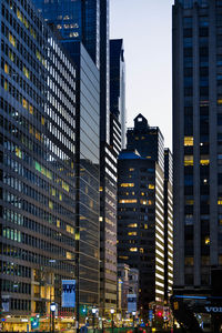 Modern buildings in city against sky