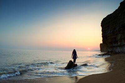 Scenic view of sea at sunset