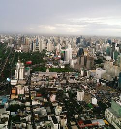 High angle view of buildings in city against sky