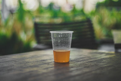 Close-up of beer glass on table