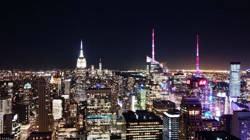 Aerial view of city lit up at night