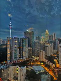 Illuminated buildings in city at night