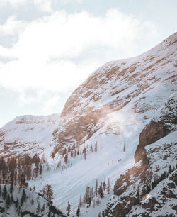 Scenic view of snow covered mountains against sky