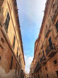 Low angle view of old building against sky