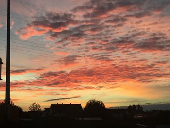 High section of orange cloudy sky at sunset