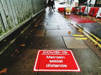 Road sign on street in city