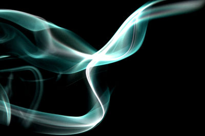 Close-up of smoke against black background