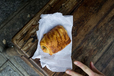 High angle view of hand by food on table