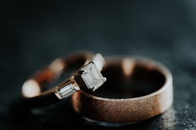 Close-up of wedding rings on table