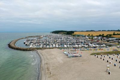 High angle view of crowd at beach against sky