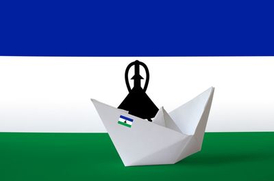 Close-up of paper flag against white background