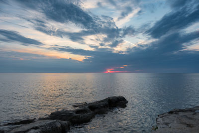 Scenic view of sea against sky during sunset