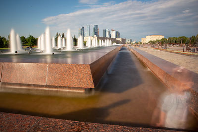 Modern buildings against sky in city