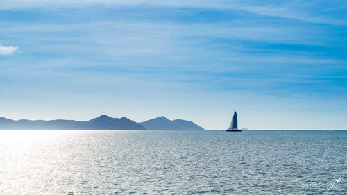 Distant view of boat sailing in sea