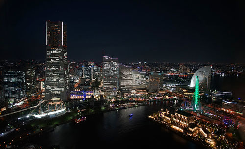 Illuminated buildings in city at night