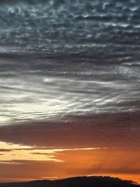 Scenic view of dramatic sky during sunset