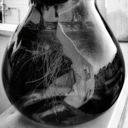 Close-up of drink in glass jar on table