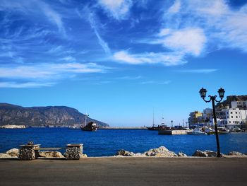 Sailboats in sea against sky