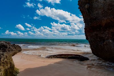 Scenic view of beach against sky