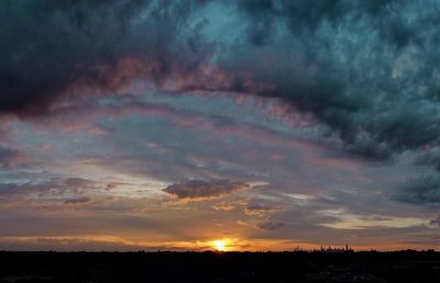 Scenic view of dramatic sky during sunset