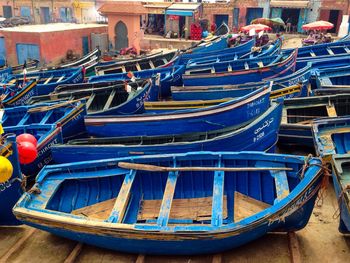 Boats moored in blue water